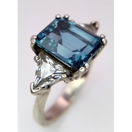 1123 - A BLUE TOPAZ SILVER RING .  5.2gms   size O