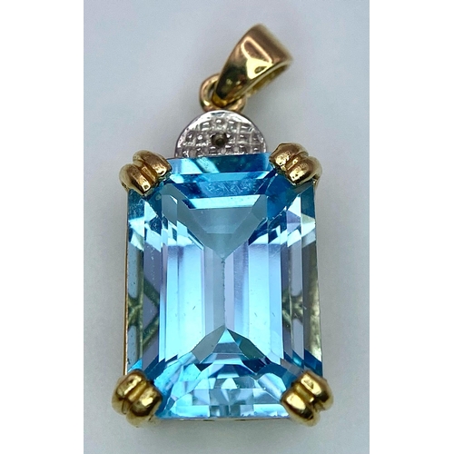 1130 - A 9K GOLD PENDANT WITH AN AQUAMARINE CENTRE STONE .   3.2gms