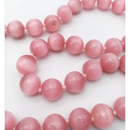 1157 - A Pink Cat's Eye Beaded Necklace. 12mm beads. 42cm necklace length