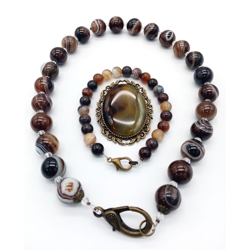 1172 - A Banded Agate Suite of Jewellery - Brooch, Necklace and Bracelet.