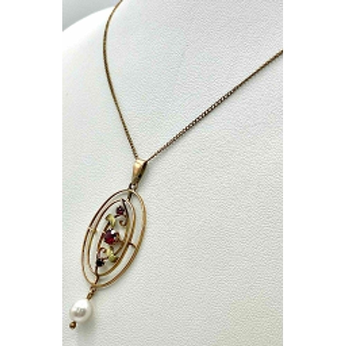 1197 - AN EDWARDIAN 9K GOLD PENDANT WITH GARNETS AND PEARLS ON A 44cms 9k GOLD CHAIN .  3.5gms