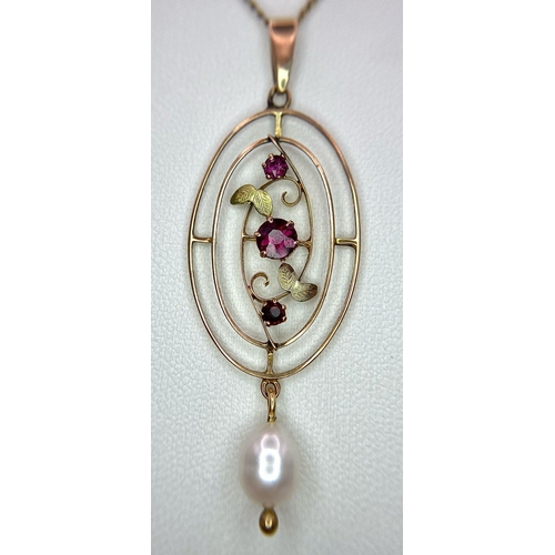 1197 - AN EDWARDIAN 9K GOLD PENDANT WITH GARNETS AND PEARLS ON A 44cms 9k GOLD CHAIN .  3.5gms