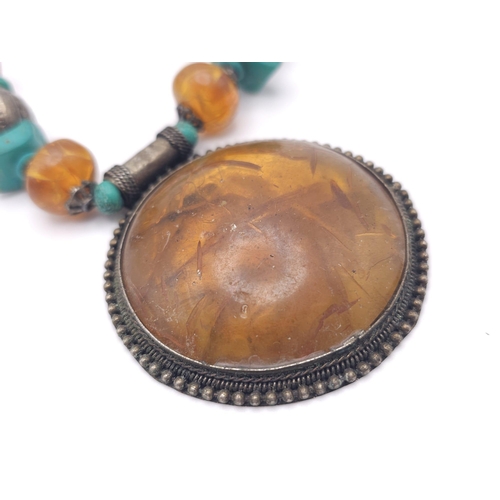 1236 - A Tribal Resin Amber Necklace with Cuff Bangle. Necklace - 46cm