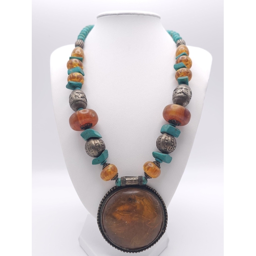 1236 - A Tribal Resin Amber Necklace with Cuff Bangle. Necklace - 46cm