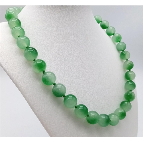 1243 - A Watermelon Jade Bead Necklace. 12mm beads. 42cm necklace length.