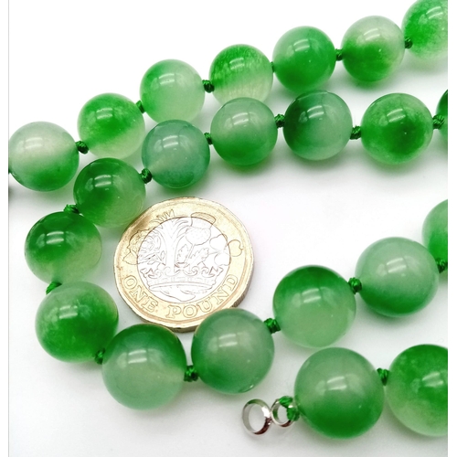 1243 - A Watermelon Jade Bead Necklace. 12mm beads. 42cm necklace length.