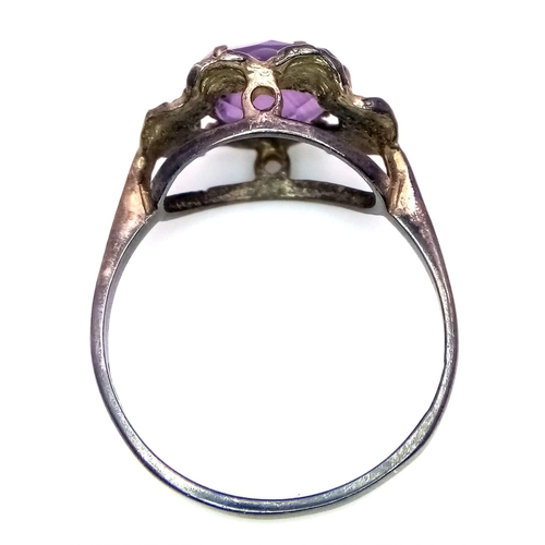 1269 - A vintage sterling silver faceted Amethyst solitaire ring. Total weight 2.1G. Size O.