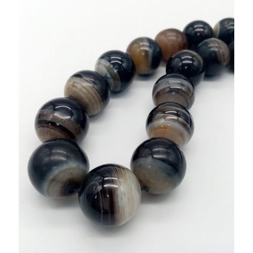 1291 - A Large Vintage Beaded Agate Necklace. 58cm. 25mm beads