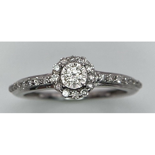 1297 - A 9K WHITE GOLD DIAMOND RING. 1.6G. SIZE L