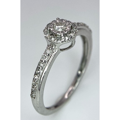 1297 - A 9K WHITE GOLD DIAMOND RING. 1.6G. SIZE L