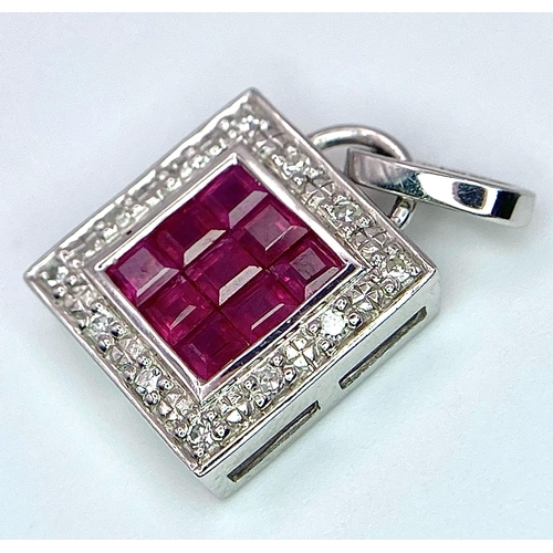 1332 - AN 18K WHITE GOLD DIAMOND & RUBY SQUARE PENDANT. 2.4G