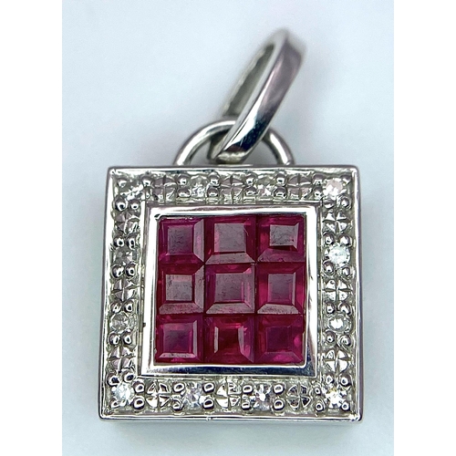 1332 - AN 18K WHITE GOLD DIAMOND & RUBY SQUARE PENDANT. 2.4G