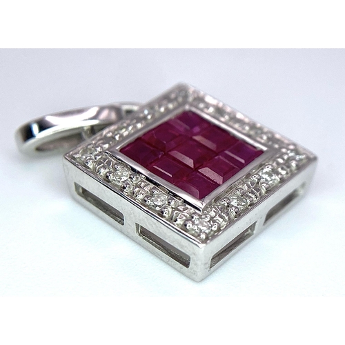 1332 - AN 18K WHITE GOLD DIAMOND & RUBY SQUARE PENDANT. 2.4G