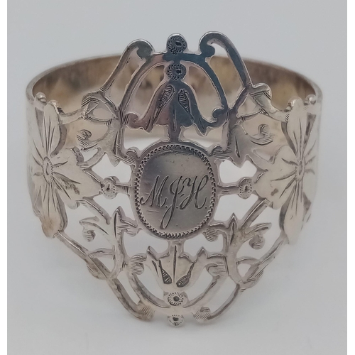 1340 - An antique sterling silver filigree napkin ring with full Birmingham hallmarks, 1903. Total weight 2... 