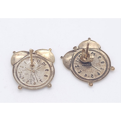 1402 - A PAIR OF 9K YELLOW GOLD ALARM CLOCK STUD EARRINGS. 0.6G