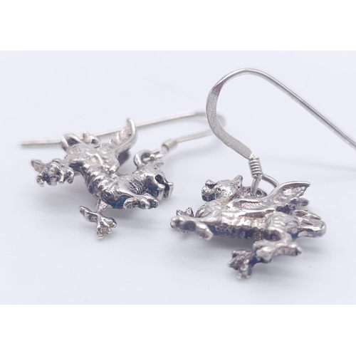 1481 - A STERLING SILVER WELSH DRAGON PAIR OF  DROP EARRINGS AND MATCHING PENDANT / CHARM. 6.5G