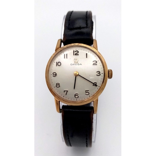 193 - A Vintage 1960s 9K Gold Case Omega Watch. Black leather strap. 9k gold case - 24mm. White dial. Mech... 