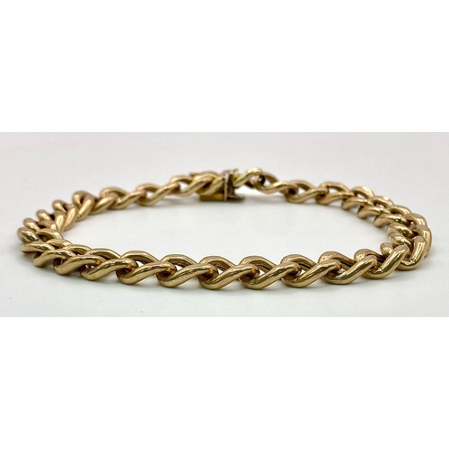 71 - A 9k yellow gold curb bracelet - 23cm length. 11.3g