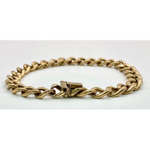 71 - A 9k yellow gold curb bracelet - 23cm length. 11.3g