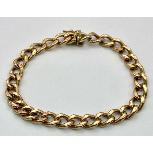 71 - A 9k yellow gold curb bracelet - 23cm length. 11.3g