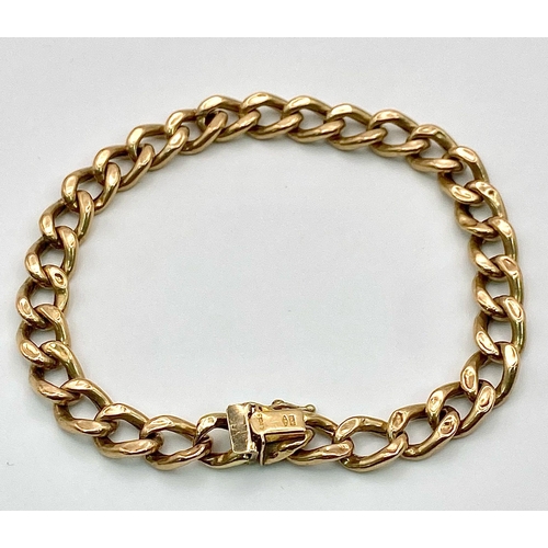 71 - A 9k yellow gold curb bracelet - 23cm length. 11.3g