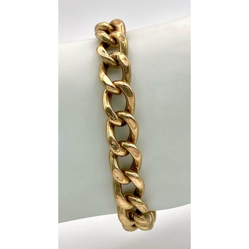 71 - A 9k yellow gold curb bracelet - 23cm length. 11.3g