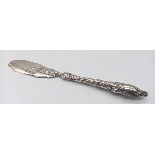 751 - An antique sterling silver fish knife with flower motif. Full hallmarks Sheffield, 1856. Total weigh... 