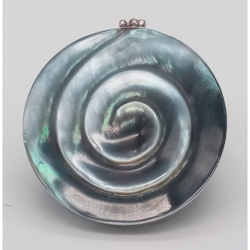 778 - A vintage 925 silver Mother of Pearl shell spiral pendant. Total weight 12.7G. Diameter: 4.7cm.