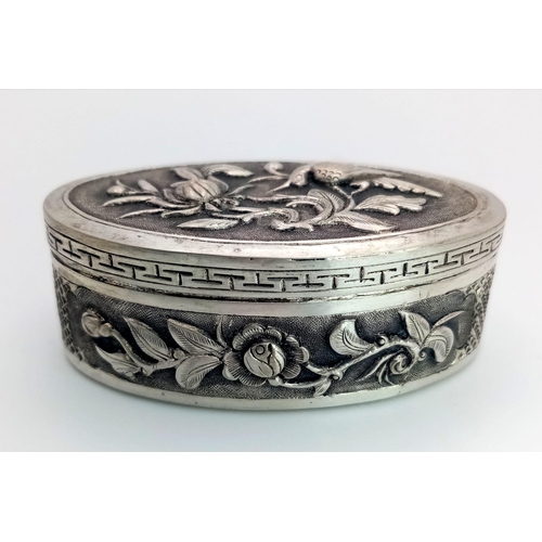 1521 - A Vintage Vietnamese Silver Pillbox. Ornate floral and bird decoration. 5.5cm x 2.5cm. 26.57g total ... 