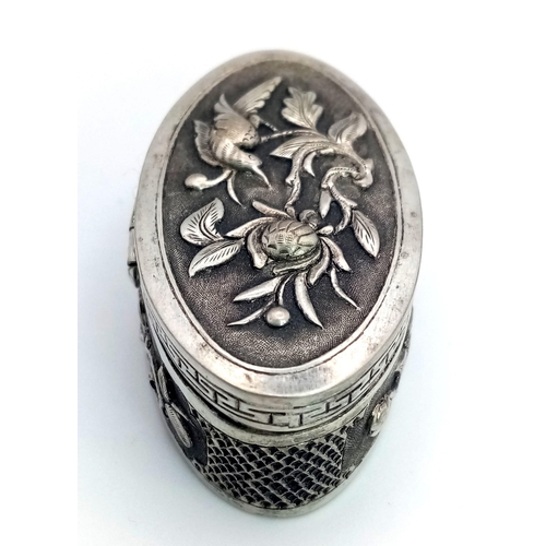 1521 - A Vintage Vietnamese Silver Pillbox. Ornate floral and bird decoration. 5.5cm x 2.5cm. 26.57g total ... 