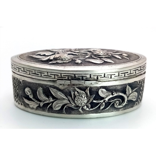 1521 - A Vintage Vietnamese Silver Pillbox. Ornate floral and bird decoration. 5.5cm x 2.5cm. 26.57g total ... 