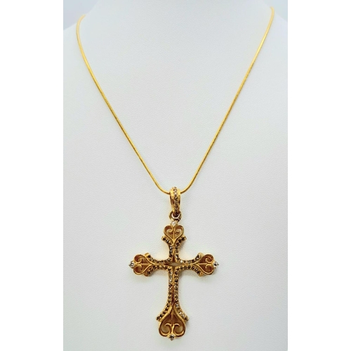 168 - A vintage (or possibly older) fancy silver and yellow gold cross with numerous old cut diamonds. In ... 