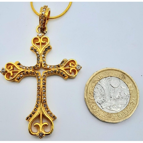 168 - A vintage (or possibly older) fancy silver and yellow gold cross with numerous old cut diamonds. In ... 