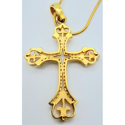 168 - A vintage (or possibly older) fancy silver and yellow gold cross with numerous old cut diamonds. In ... 