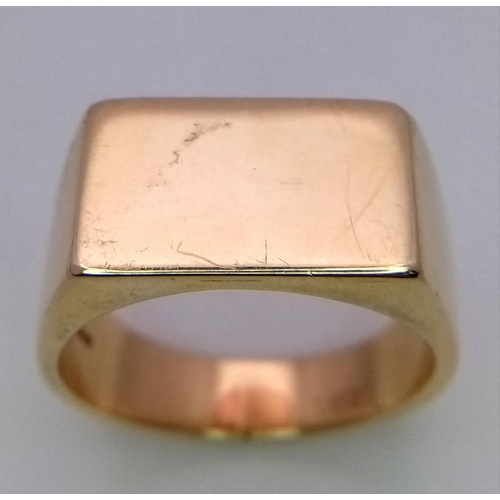 178 - A 9k yellow gold plain rectangular signet ring. 12.3g. Size T