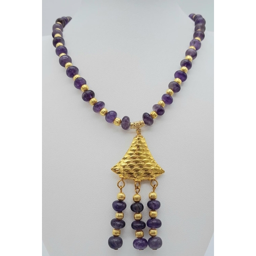 182 - A very glamorous amethyst necklace and earrings set with lavishly gold-filled parts. Necklace length... 