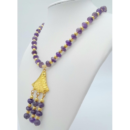 182 - A very glamorous amethyst necklace and earrings set with lavishly gold-filled parts. Necklace length... 