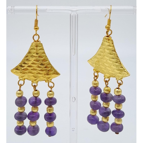 182 - A very glamorous amethyst necklace and earrings set with lavishly gold-filled parts. Necklace length... 