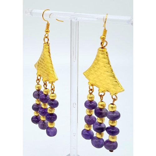 182 - A very glamorous amethyst necklace and earrings set with lavishly gold-filled parts. Necklace length... 