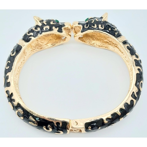 189 - A classic vintage PANTHER double headed bangle in the style of Mrs Wallis Simpson, Duchess of Windso... 