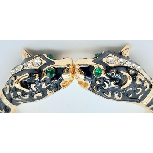 189 - A classic vintage PANTHER double headed bangle in the style of Mrs Wallis Simpson, Duchess of Windso... 