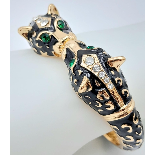 189 - A classic vintage PANTHER double headed bangle in the style of Mrs Wallis Simpson, Duchess of Windso... 