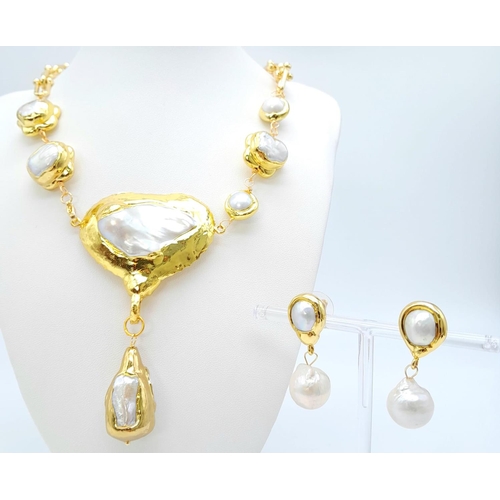 315 - A glamorous and unusual necklace and earrings set with large baroque natural pearls. Necklace length... 