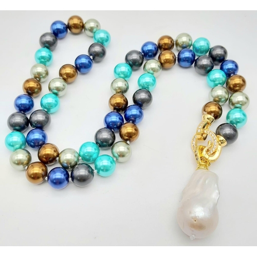 344 - A Colourful South Sea Pearl Shell Necklace with Hanging Large Baroque Pearl. Gilded and white stone ... 