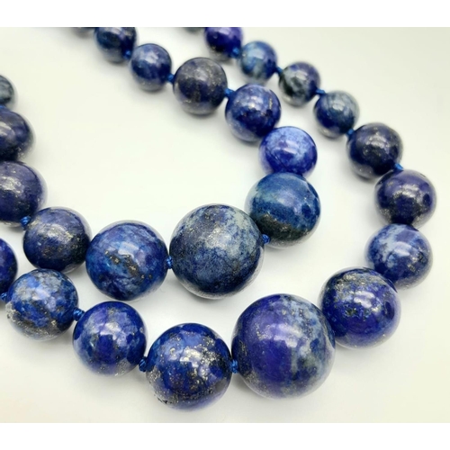 401 - A Two Row Lapis Lazuli Graduated Bead Necklace. 6-14mm beads. 44cm necklace length.