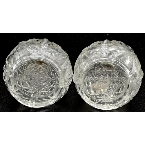 1004 - A PAIR OF VINTAGE SILVER TOPPED CUT GLASS SALT AND PEPPER POTS .   6cms IN HEIGHT   92.4gms