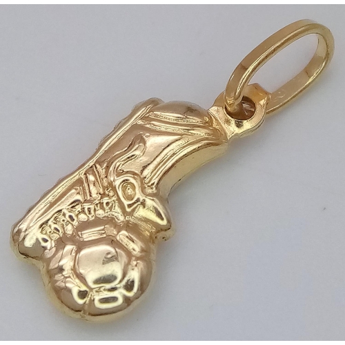 1398 - A 9K YELLOW GOLD FOOTBALL BOOT AND BALL CHARM. 0.6G