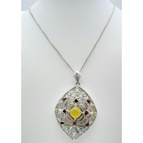 537 - AN IMPRESSIVE SILVER PENDANT DECORATED WITH COLOURFUL GEMSTONES ON A 50cms SILVER CHAIN.  9.8gms