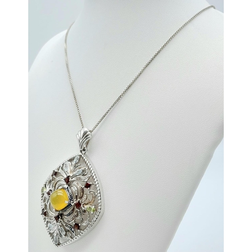 537 - AN IMPRESSIVE SILVER PENDANT DECORATED WITH COLOURFUL GEMSTONES ON A 50cms SILVER CHAIN.  9.8gms