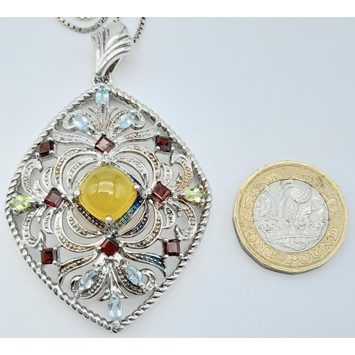 537 - AN IMPRESSIVE SILVER PENDANT DECORATED WITH COLOURFUL GEMSTONES ON A 50cms SILVER CHAIN.  9.8gms